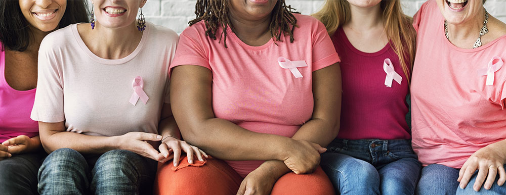 Women wearing pink ribbon